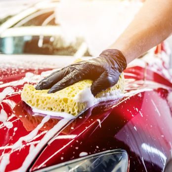 A-1 team member hand washing a car